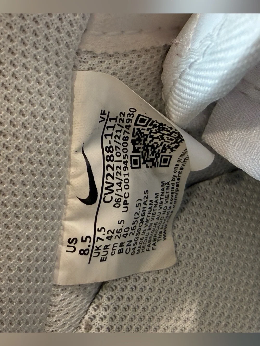 These are iconic Nike Air Force 1 sneakers in an all-white colorway.